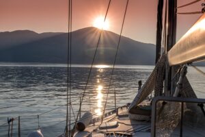 sunset over the mountains from catamaran