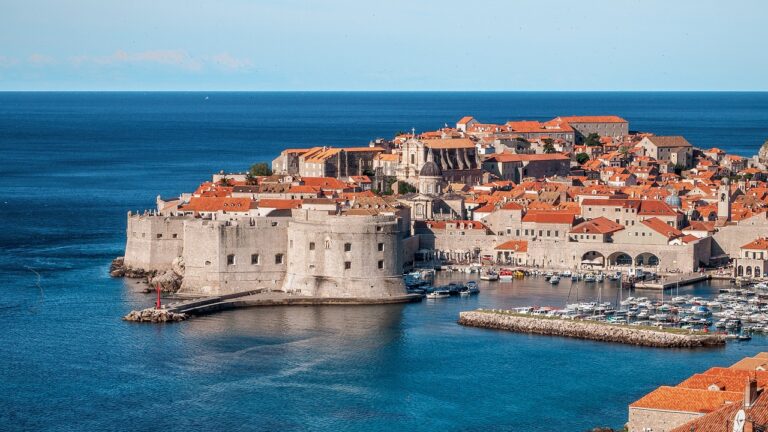 old stone fortress with bright orange tile roofs in dubrovnik croatia