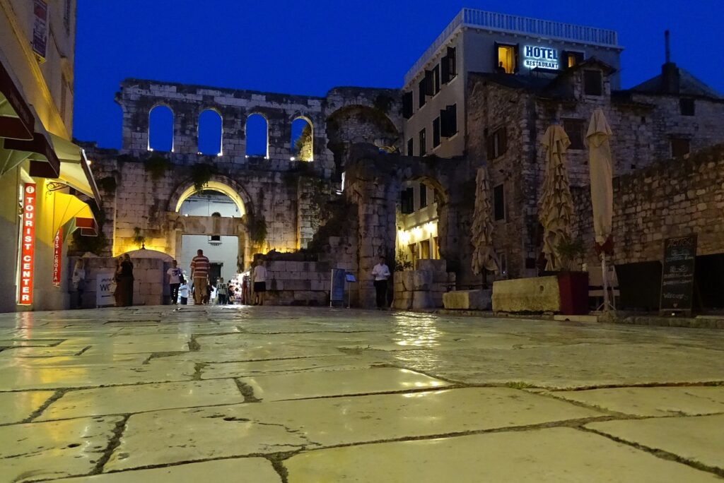 stone tiles in foreground and ancient palace in background at Diocletian's Palace Split Croatia