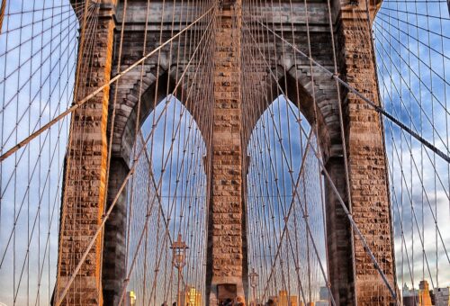 Brooklyn Bridge with a few visitors, showcasing its beauty that is one of the best Places to Visit in the USA