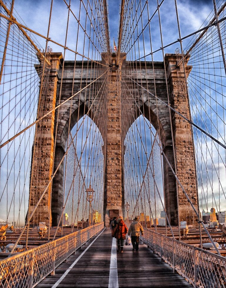 Brooklyn Bridge with a few visitors, showcasing its beauty that is one of the best Places to Visit in the USA